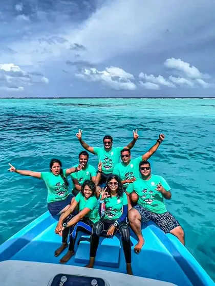 Diving is better with friends! A huge part of our expeditions is the community you build. Here's one of our happy groups soaking in the Maldivian blues after a fantastic day of diving.