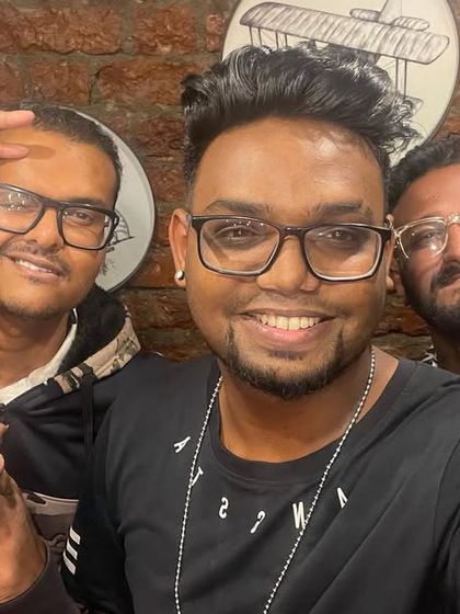 Hanging with my crew before a live performance. We bring a collective energy to our hip-hop nights, ensuring an authentic and exciting show.