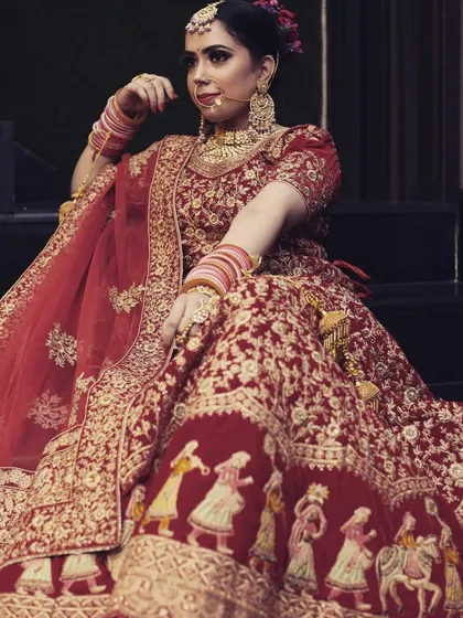 A beautiful seated portrait showcasing the unique baraat procession embroidered on the bride's lehenga. It’s details like these that I love to capture.