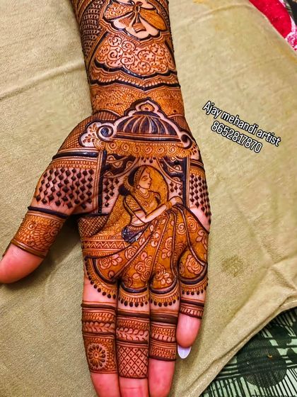 A classic bridal portrait showing the bride in her ghunghat (veil). This style of figurative mehndi is elegant and timeless, perfect for the traditional bride.