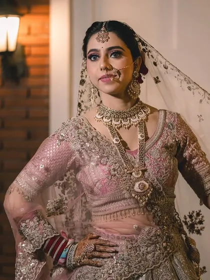 Capturing the bride's personality. This pose is full of grace and attitude, showing off the flow of her veil and the detailed work on her outfit.