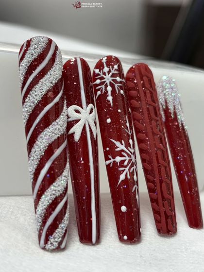 Another look at the beautiful red and white Christmas nail art, perfect for getting into the holiday spirit.