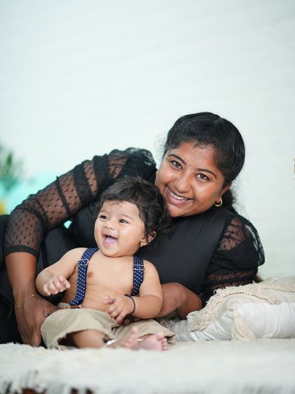 A happy six-month-old and me! I love capturing these moments of connection with the babies I photograph.