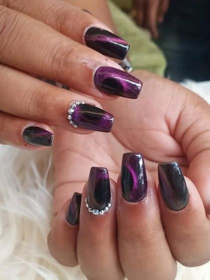 Another angle of the deep purple cat-eye nails, showing how the magnetic polish creates a shifting line of light.