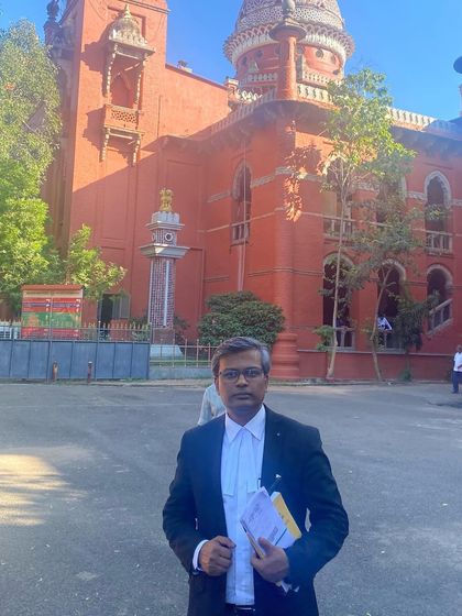 Outside the historic Madras High Court building in Chennai, where I handle litigation involving complex criminal matters.