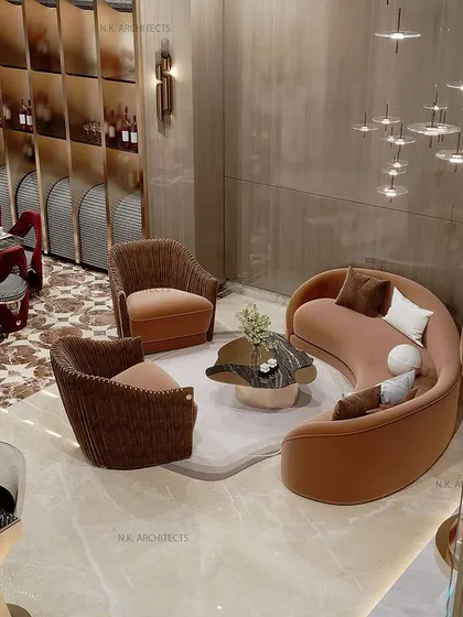 A double-height living and dining area creates an immediate sense of grandeur. We designed this space to feel open and luxurious, perfect for hosting family dinners or formal events, with a stunning staircase and curated furniture that complements the scale of the room.