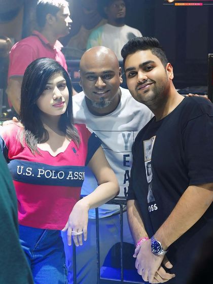 Posing with a guest and another DJ. My events are a hub for the Bangalore nightlife community.