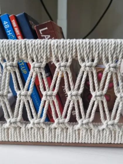 Another view of the macrame basket as a book holder, keeping your current reads tidy and accessible.