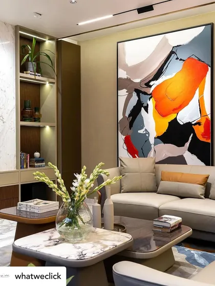 This large-scale abstract canvas, 'Colour Cluster', brings a dynamic energy to a modern living room. The bold strokes and vibrant color palette create a powerful focal point, designed to complement and elevate the surrounding interior design.