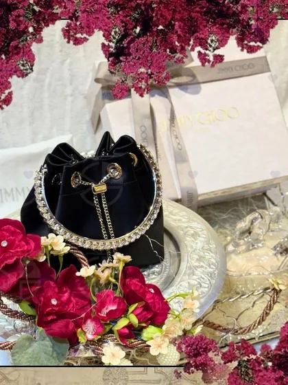 Presenting a gift of pure luxury. For this trousseau, I created a stunning floral-themed display for a classic Jimmy Choo handbag, making the unboxing moment truly special and memorable.