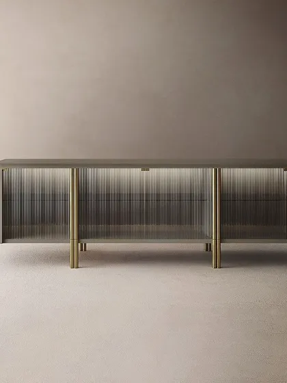 A full view of the sophisticated sideboard, showing how the tempered fluted glass doors play with light and transparency.