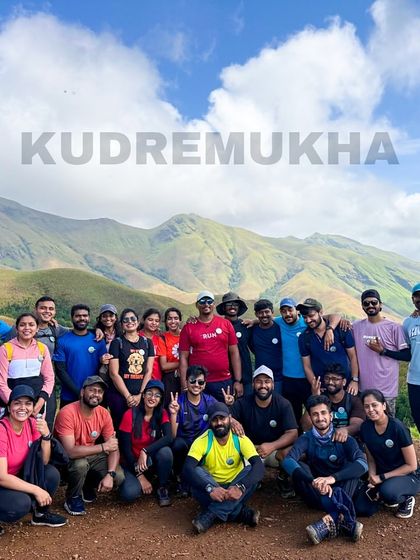 A fantastic group photo with the majestic Kudremukha range in the background. The smiles say it all.