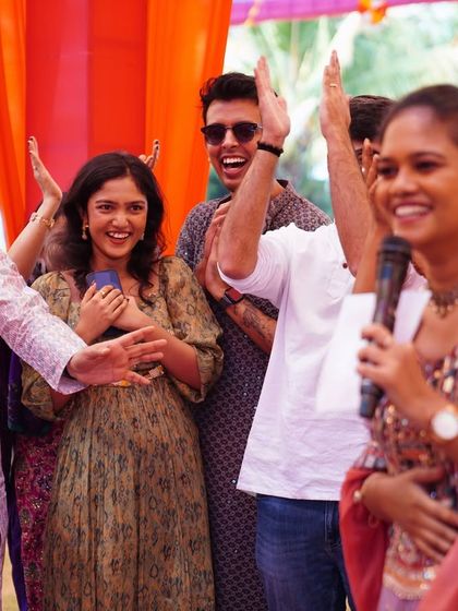 The joy is contagious! Guests cheering and clapping during the Mehendi festivities.