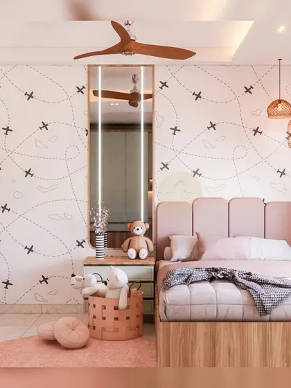 A dreamy kids' room with a travel-themed wallpaper and a soft pink upholstered headboard. The design is serene and playful, creating a perfect environment for a child to grow.