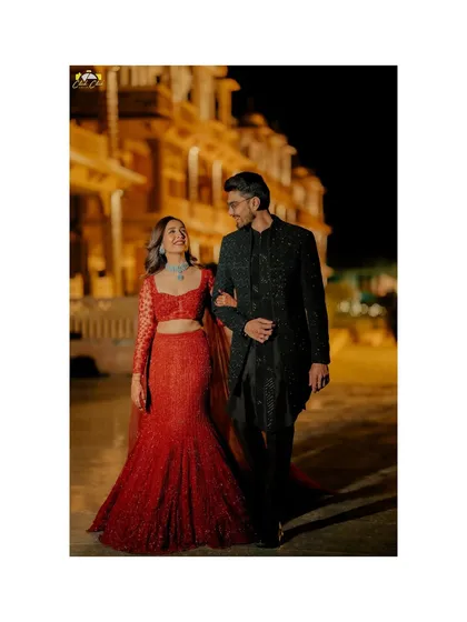 A romantic walk through the beautifully lit venue. We captured this couple against the architectural elegance of their sangeet location.