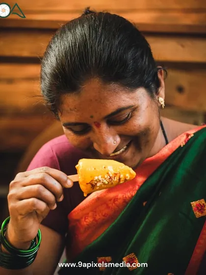 The final result of our mango story: a woman enjoying a homemade mango kulfi with a smile of pure delight. This brings the story full circle, from the farm to a happy customer.
