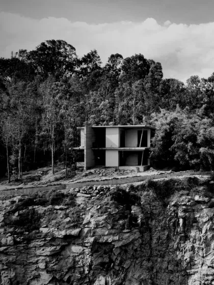 A dialogue between structure and surroundings. A single cottage from the resort project perches on the cliff edge, designed with intent and precision.