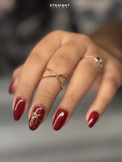 A close-up of the beautifully hand-painted gold bow. The fine lines and glossy finish make this a sophisticated and celebratory accent.