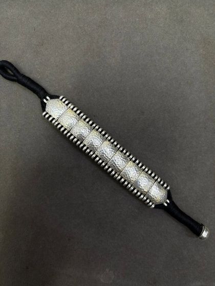 The same beautiful woven bracelet, here with hammered silver squares on a black thread. Perfect for a minimalist, monochrome look.