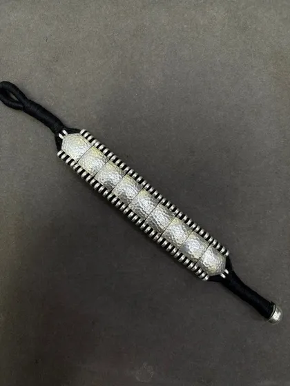 The same beautiful woven bracelet, here with hammered silver squares on a black thread. Perfect for a minimalist, monochrome look.