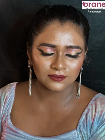 A glamorous magazine look with dramatic winged eyeliner and sparkling pink eyeshadow.