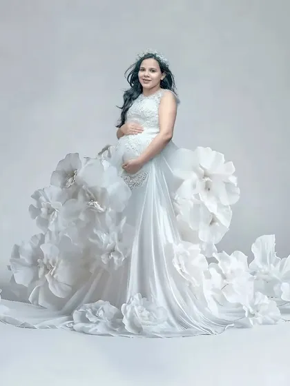 This is one of my most creative concepts, a gown made of giant paper flowers. This couture-style portrait is perfect for mothers who want a one-of-a-kind, high-fashion maternity photo.