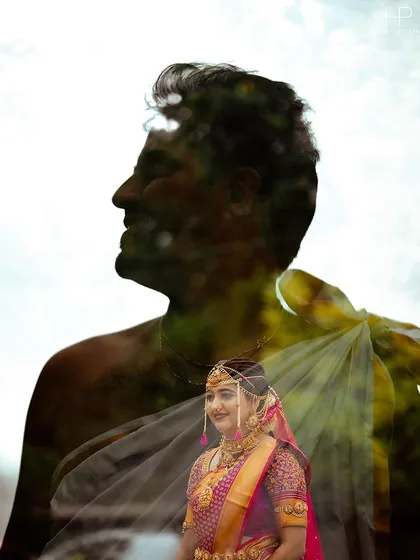 An artistic double exposure, blending a portrait of the bride with the silhouette of her groom.