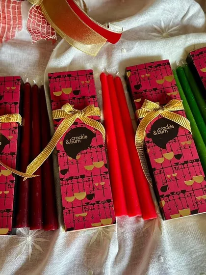 My tapered candles come in these beautiful custom boxes, making them a perfect gift. Here you can see them in festive red and green.