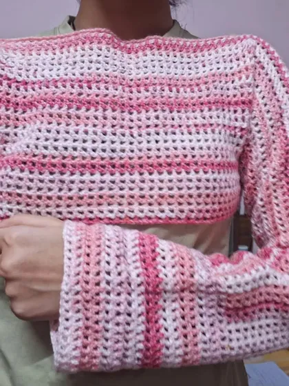 This is a custom mesh bolero or shrug I made, featuring a lovely pink gradient yarn.