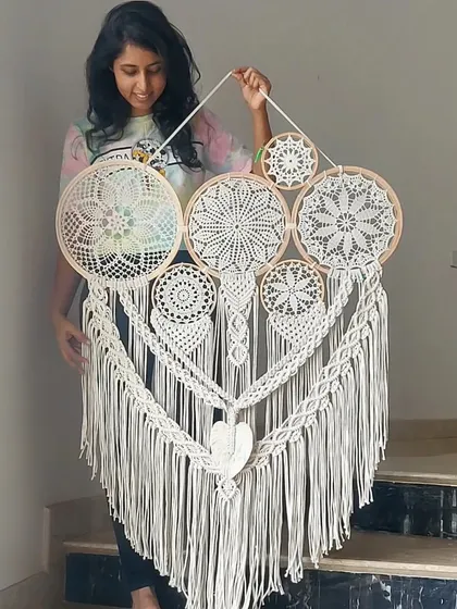 The beauty of macrame is in its versatility. We created this large, all-white cluster dreamcatcher to be a fusion of intricate artistry and bohemian charm, promising to infuse warmth and elegant style into any room it graces.