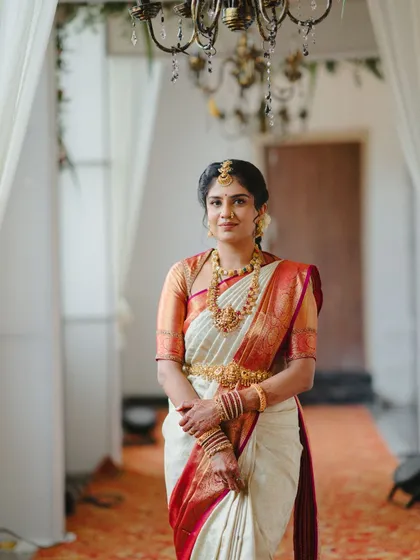 A full-length portrait of this bride, her grace and beauty shining through in her traditional attire.