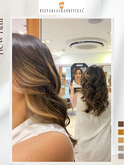 A mirror selfie capturing the fresh, glossy look of these sun-kissed highlights. This is a great low-maintenance color for adding brightness around the face.