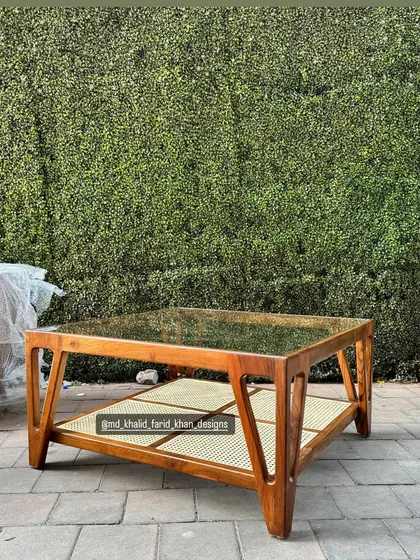 Another view of the glass and cane coffee table.