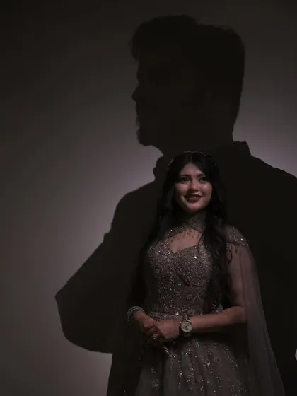 A creative exploration of love and connection. Using shadow play, this portrait tells a story of two people intertwined, where her smile is lit by his silhouette, showcasing my conceptual approach.