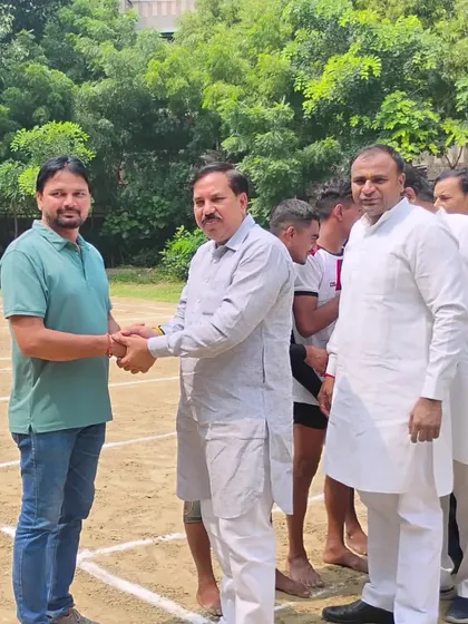 Me, the coach, shaking hands with an official at the Gazipur senior district tournament.