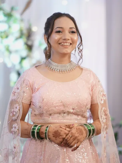 The complete engagement look, showing the beautiful smile of a happy client. The natural, dewy makeup ensures she looks fresh and radiant throughout her special day.