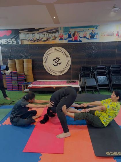 Another variation of a partner forward bend. This helps to open up the back and shoulders for one partner, while the other gets a hamstring stretch.