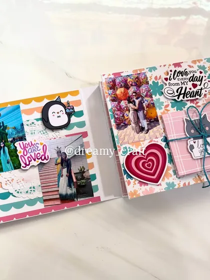 A colorful and vibrant two-page spread from a memory album, filled with photos, stickers, and a small, tied-up note.