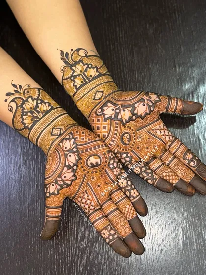 This design for a groom's sister is just as detailed as a bridal piece, featuring elephants and lotus motifs.