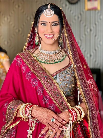 Priya's radiant smile says it all. Her dewy skin and soft bronze eye makeup created a look of pure elegance for her wedding day.