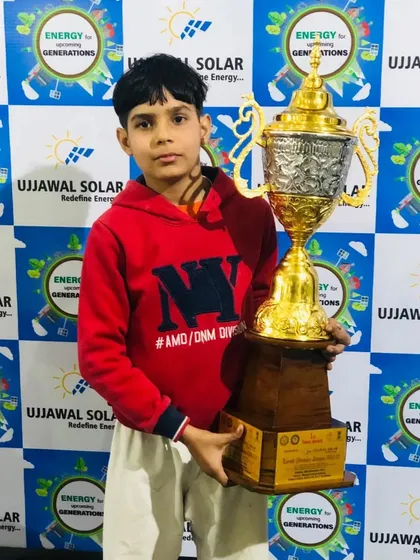 Ritesh Chauhan with the championship trophy. His individual performance was outstanding.