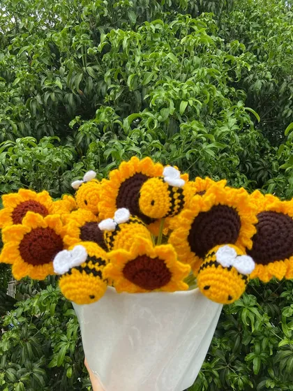 A custom bouquet of sunflowers decorated with my cute amigurumi bees.