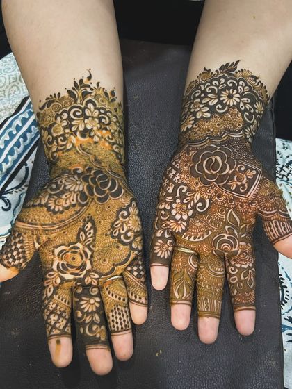 This design combines different floral styles on each hand. One is a classic rose pattern, while the other uses negative space for a modern feel.