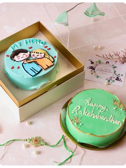 Our Rakhi special bento cakes are the perfect way to celebrate your sibling bond. This set includes a cute "My Hero" cake and a "Happy Rakshabandhan" cake.