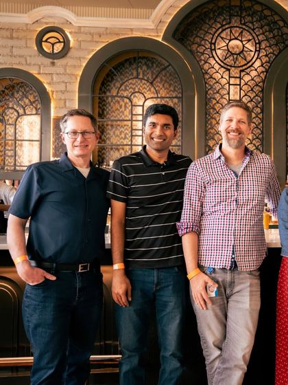 Guests from an international team event gather at the bar. My venue is well-suited to host professional and corporate groups of all kinds in a stylish, welcoming environment.