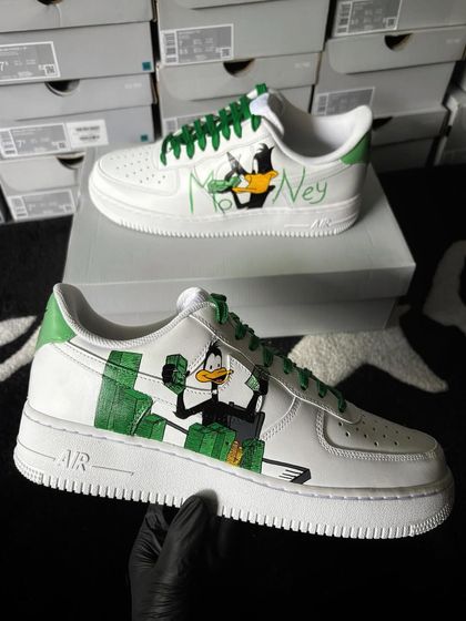 Another angle of the Daffy Duck custom sneakers, showing him swimming in cash.