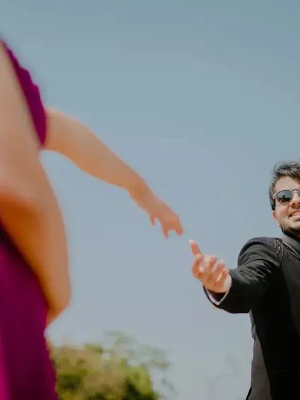 A playful and creative shot, capturing the moment just before their hands meet. This kind of photo adds a fun, narrative element to your pre-wedding story.