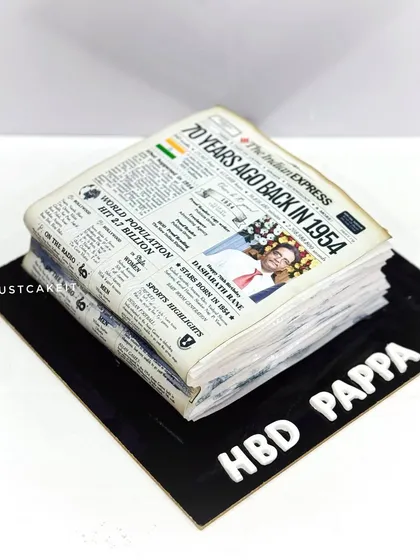 An all-edible cake designed to look like a vintage newspaper from 1954 for a 70th birthday. This was for a former copywriter head at 'The Indian Express'.
