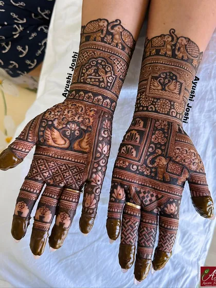The full view of the Karva Chauth mehendi, with the dark henna paste still on, showing the precision of the application.