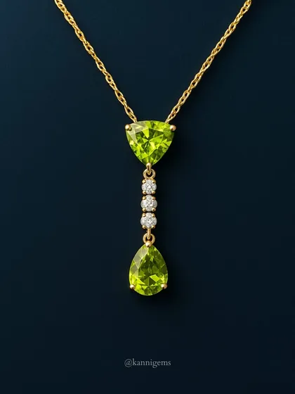 A closer view of the peridot and diamond pendant. The unique trillion-cut stone at the top adds a modern touch to this otherwise classic design.